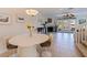 Elegant dining area with a modern chandelier, stylish chairs, and a seamless flow to the living spaces at 1625 Watermark Ne Cir, St Petersburg, FL 33702