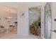 Welcoming entryway showcasing a dining room and staircase, enhanced by natural light and stylish decor at 1625 Watermark Ne Cir, St Petersburg, FL 33702