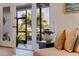 Inviting living room with French doors leading to an outdoor patio, offering scenic waterfront views and natural light at 1625 Watermark Ne Cir, St Petersburg, FL 33702