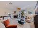 Comfortable living room with a cozy fireplace, French doors to the patio, and ample natural light and seating at 1625 Watermark Ne Cir, St Petersburg, FL 33702