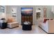 Cozy living room featuring tile floors, modern furniture, and bright windows at 1625 Watermark Ne Cir, St Petersburg, FL 33702