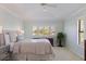 Serene main bedroom featuring carpet, large windows, and neutral color palette at 1625 Watermark Ne Cir, St Petersburg, FL 33702
