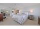The spacious main bedroom features bright interior, carpet floors, and large windows at 1625 Watermark Ne Cir, St Petersburg, FL 33702