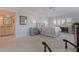 This is a spacious bedroom with calming tones, featuring a large window and an en suite bathroom at 1625 Watermark Ne Cir, St Petersburg, FL 33702