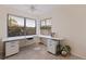 Dedicated office space with a spacious desk area and natural light from large windows at 1625 Watermark Ne Cir, St Petersburg, FL 33702