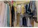 Organized walk-in closet with shelves and hanging rods provides ample storage space for clothing and accessories at 1625 Watermark Ne Cir, St Petersburg, FL 33702