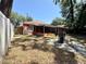 The backyard features a screen porch and mature landscaping, offering privacy at 1813 Landside Dr, Valrico, FL 33594