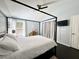 Bedroom features a bed, desk, dark wood floors, ceiling fan and vaulted ceiling at 1813 Landside Dr, Valrico, FL 33594
