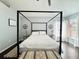 Bedroom features a bed, two end tables, dark wood floors, ceiling fan and vaulted ceiling at 1813 Landside Dr, Valrico, FL 33594