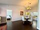 Open-concept dining room featuring hardwood floors and natural light, perfect for entertaining at 1813 Landside Dr, Valrico, FL 33594