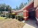 Charming home entrance featuring well-maintained landscaping and an inviting front door at 1813 Landside Dr, Valrico, FL 33594