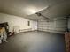 Spacious garage with ample room for parking and storage, featuring a neutral color palette at 1813 Landside Dr, Valrico, FL 33594