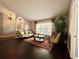 Inviting living room with hardwood floors, ample seating, and a large window for natural light at 1813 Landside Dr, Valrico, FL 33594