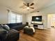 Cozy living room with a comfortable sectional sofa, entertainment center, and natural light at 1813 Landside Dr, Valrico, FL 33594