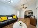 Comfortable living room with yellow accent pillows and view to another living area at 1813 Landside Dr, Valrico, FL 33594