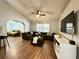 Spacious living room showcasing a large sectional sofa, modern TV, and an archway leading to another room at 1813 Landside Dr, Valrico, FL 33594