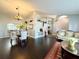 Spacious dining and living areas featuring elegant hardwood floors, ample natural light, and stylish decor at 1813 Landside Dr, Valrico, FL 33594