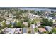 Beautiful aerial view of a home situated near the water with mature trees and neighborhood charm at 1842 Bayou Grande Ne Blvd, St Petersburg, FL 33703