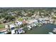 Aerial view of the house in a community with boat docks and water access at 1842 Bayou Grande Ne Blvd, St Petersburg, FL 33703