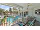 Relaxing balcony with outdoor seating and views of the pool and tropical landscaping at 1842 Bayou Grande Ne Blvd, St Petersburg, FL 33703