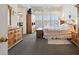 Bedroom featuring wood furniture, a ceiling fan, and shuttered windows at 1842 Bayou Grande Ne Blvd, St Petersburg, FL 33703