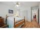 Bedroom with wooden floors, closet, and soft natural light at 1842 Bayou Grande Ne Blvd, St Petersburg, FL 33703