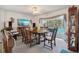 Elegant dining room with a wooden table and chairs, perfect for entertaining guests or Gathering dinners at 1842 Bayou Grande Ne Blvd, St Petersburg, FL 33703
