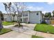 Charming two-story home with a well-manicured lawn and a spacious driveway at 1842 Bayou Grande Ne Blvd, St Petersburg, FL 33703