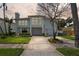 Charming two-story home with landscaped yard, dual garage, and American flag at 1842 Bayou Grande Ne Blvd, St Petersburg, FL 33703