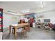 Garage workshop area with large table and overhead lighting at 1842 Bayou Grande Ne Blvd, St Petersburg, FL 33703