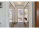 Hallway view showcasing the bathroom featuring mirrored closet doors at 1842 Bayou Grande Ne Blvd, St Petersburg, FL 33703