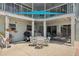 Covered patio with furnishings, a grill, and access to the house at 1842 Bayou Grande Ne Blvd, St Petersburg, FL 33703