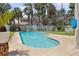 Backyard pool area surrounded by lush landscaping and a privacy fence at 1842 Bayou Grande Ne Blvd, St Petersburg, FL 33703