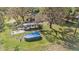 View of the backyard, pool, and outdoor entertaining space, perfect for relaxing or hosting gatherings at 18838 Huckavalle Rd, Odessa, FL 33556