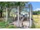 A charming chicken coop with a secure enclosure provides a safe and comfortable home for the chickens at 18838 Huckavalle Rd, Odessa, FL 33556