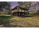 Inviting home with a wraparound porch, perfect for enjoying outdoor living and sunset views at 18838 Huckavalle Rd, Odessa, FL 33556