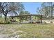 Expansive outdoor covered space with ample seating, perfect for relaxing and entertaining guests at 18838 Huckavalle Rd, Odessa, FL 33556