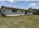 Exterior view of back of the house with windows at 1905 Meridel Ave, Tampa, FL 33612