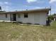 Exterior view of the back of the house showing doors, windows, and exterior access at 1905 Meridel Ave, Tampa, FL 33612