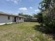 Backyard including grass and fencing at 1905 Meridel Ave, Tampa, FL 33612