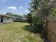 Backyard including grass and fencing at 1905 Meridel Ave, Tampa, FL 33612