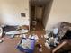 View of cluttered bedroom needing renovation with trash strewn across the floor at 1905 Meridel Ave, Tampa, FL 33612