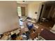 View of cluttered bedroom needing renovation with plywood covered window and trash strewn across the floor at 1905 Meridel Ave, Tampa, FL 33612