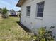 Exterior showing three windows along side of a house with a chain-link fence at 1905 Meridel Ave, Tampa, FL 33612