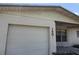 Close up of the garage, house number, and front window at 1905 Meridel Ave, Tampa, FL 33612