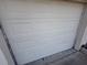 Garage door featuring paneled design on a white house at 1905 Meridel Ave, Tampa, FL 33612