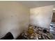 Living room showing walls, flooring and some discarded furniture and other items at 1905 Meridel Ave, Tampa, FL 33612