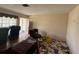 Another view of the living room shows the door and condition of the space at 1905 Meridel Ave, Tampa, FL 33612