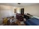 Living room showing walls, flooring and some discarded furniture and other items at 1905 Meridel Ave, Tampa, FL 33612