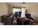 An alternative view of the living room space with natural light entering at 1905 Meridel Ave, Tampa, FL 33612